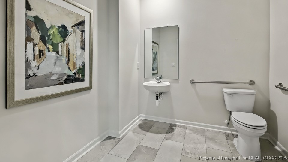 45 Mercer Way Spring Lake, NC 28390 - Photo 27 of 35 a bathroom with a toilet and a shower