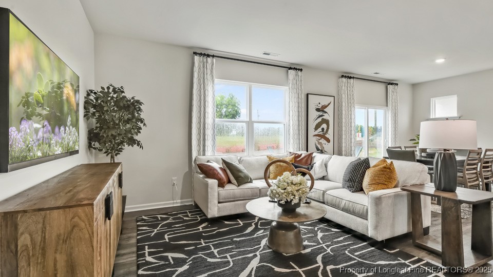 45 Mercer Way Spring Lake, NC 28390 - Photo 5 of 35 a living room with furniture and a large window