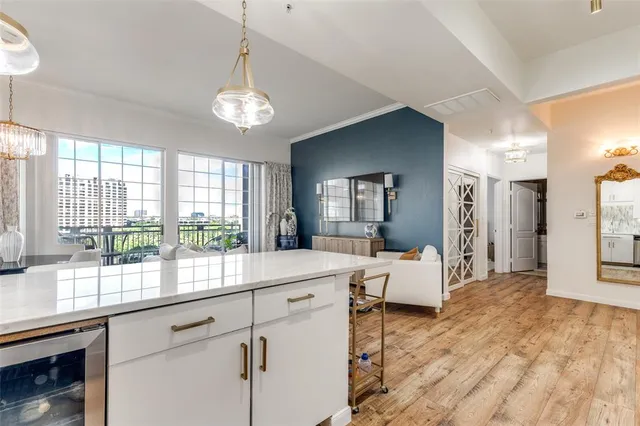 a very nice looking room with a large window and chandelier