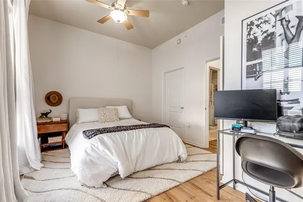 a bedroom with a bed and a chair