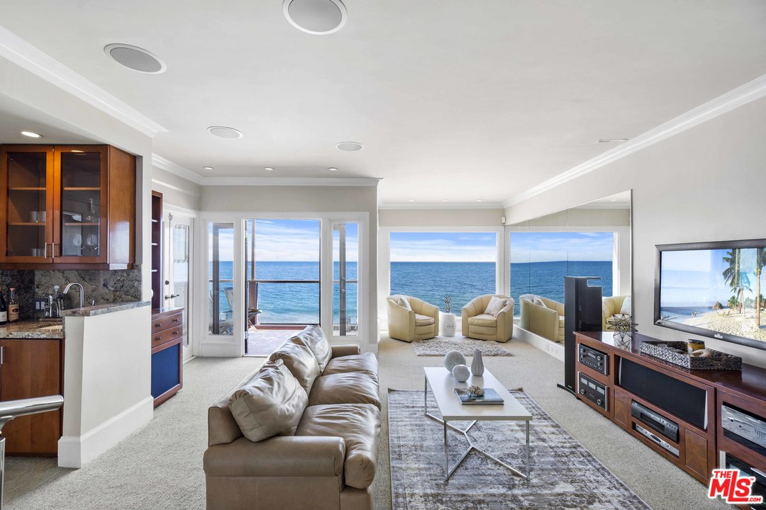 22630 Pacific Coast Highway Malibu, CA 90265 - Photo 1 of 24 a living room with furniture and a large window