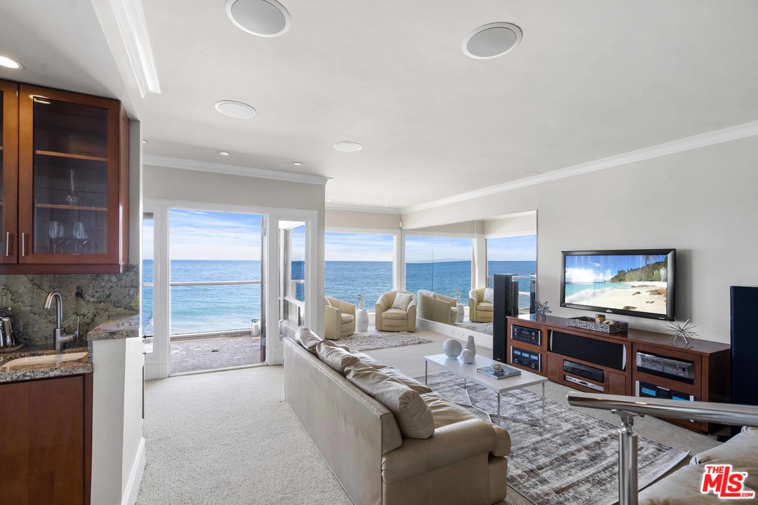 22630 Pacific Coast Highway Malibu, CA 90265 - Photo 2 of 24 a living room with furniture and a flat screen tv