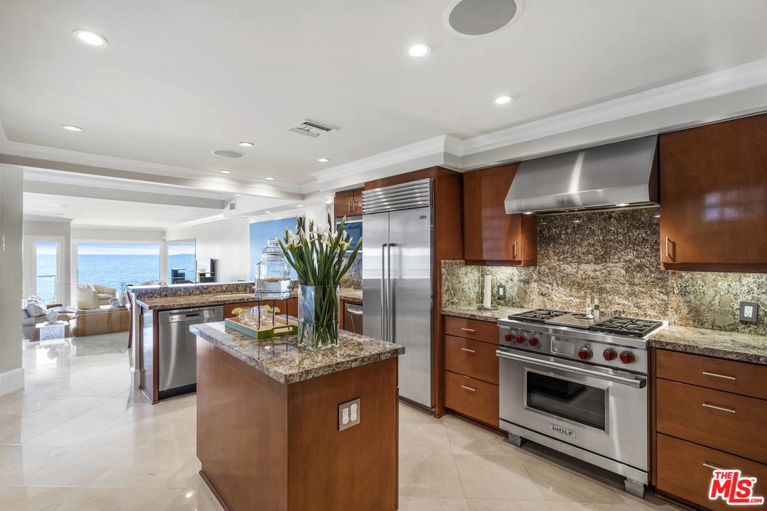 22630 Pacific Coast Highway Malibu, CA 90265 - Photo 9 of 24 a kitchen with stainless steel appliances granite countertop a stove and a sink