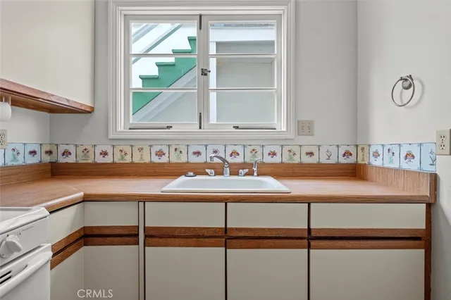 a bathroom with a sink and a window