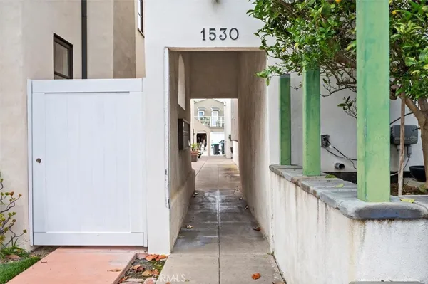 a view of a hallway with wooden walls and stairs