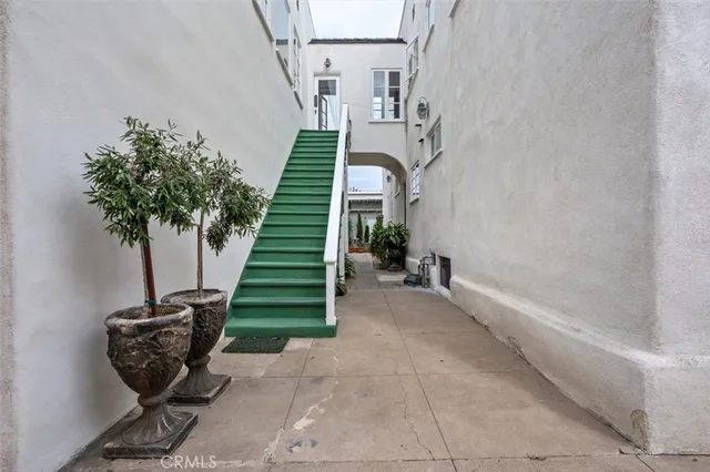 a view of a room with stairs and a potted plant