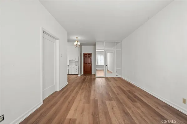 a view of hallway with wooden floor