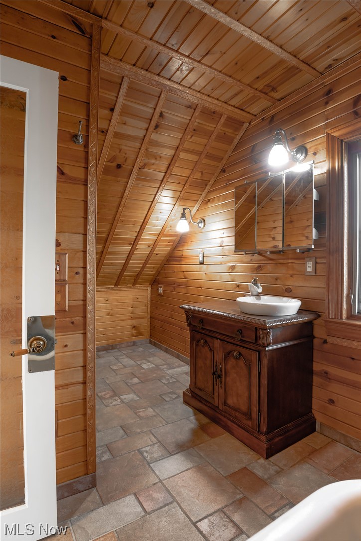 170 Avon Belden Road Avon Lake, OH 44012 - Photo 17 of 18 Bathroom with wooden walls, vanity with extensive cabinet space, and wooden ceiling