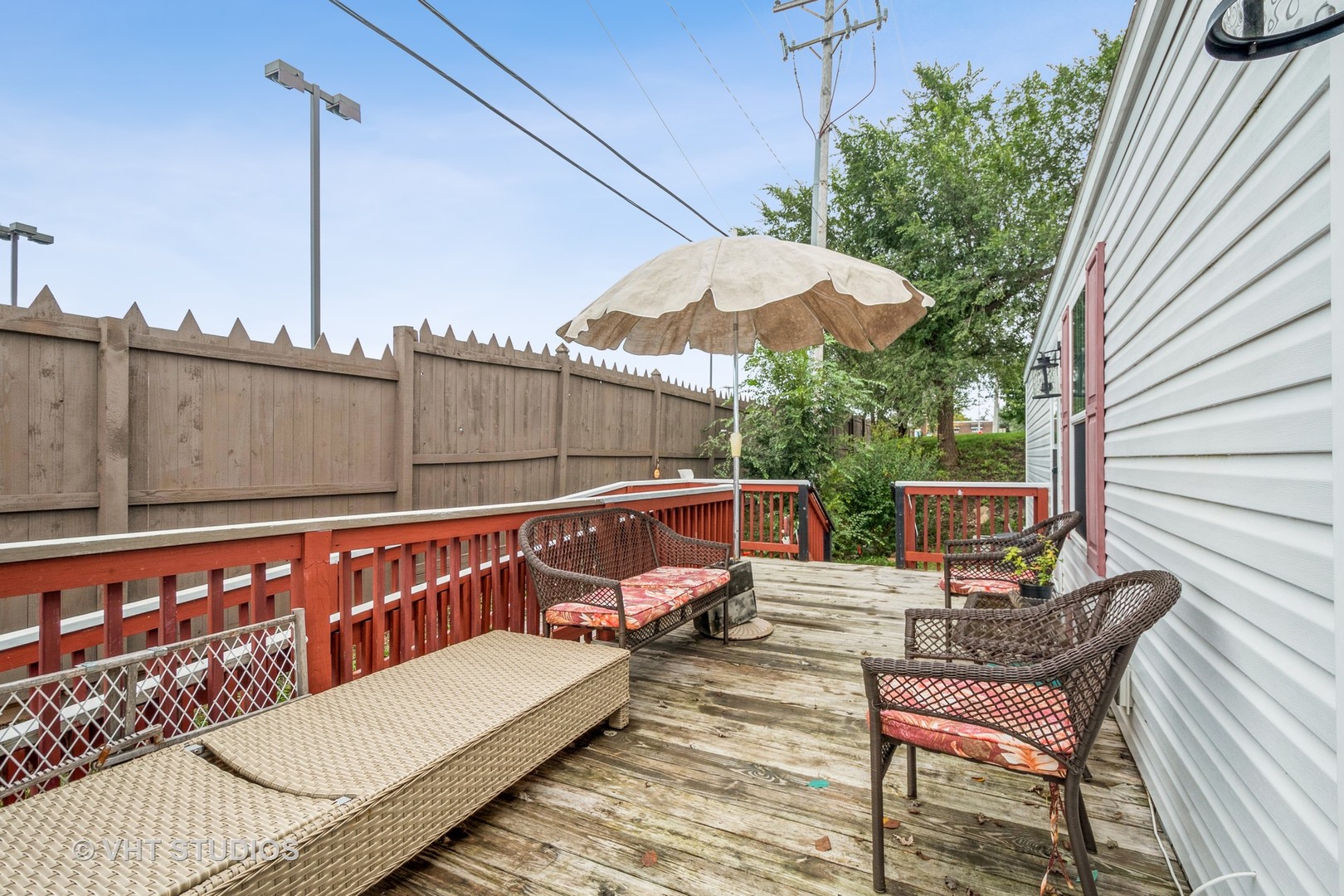 304 3rd Street Northfield, IL 60093 - Photo 3 of 14 a white house with a small yard and wooden fence