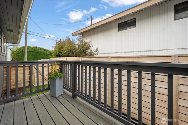 a view of a balcony with wooden floor