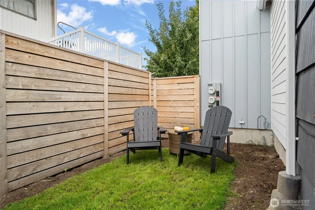 a view of a chair in backyard of the house
