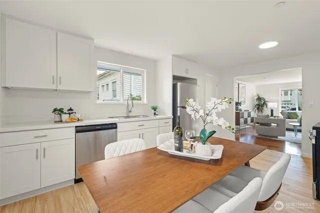 a view of a dining room with furniture and wooden floor