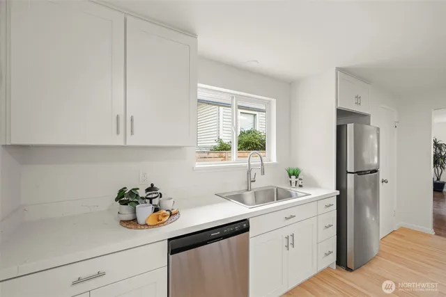a kitchen with a sink and cabinets