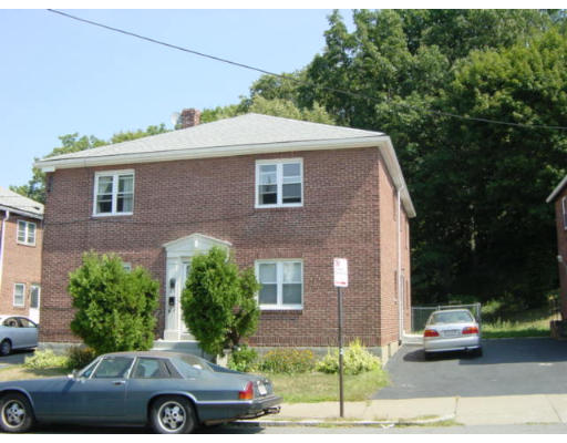 a front view of a house with parking