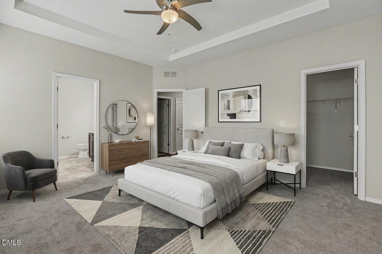 132 Daneborg Road Durham, NC 27703 - Photo 10 of 37 a bedroom with a bed and a chandelier
