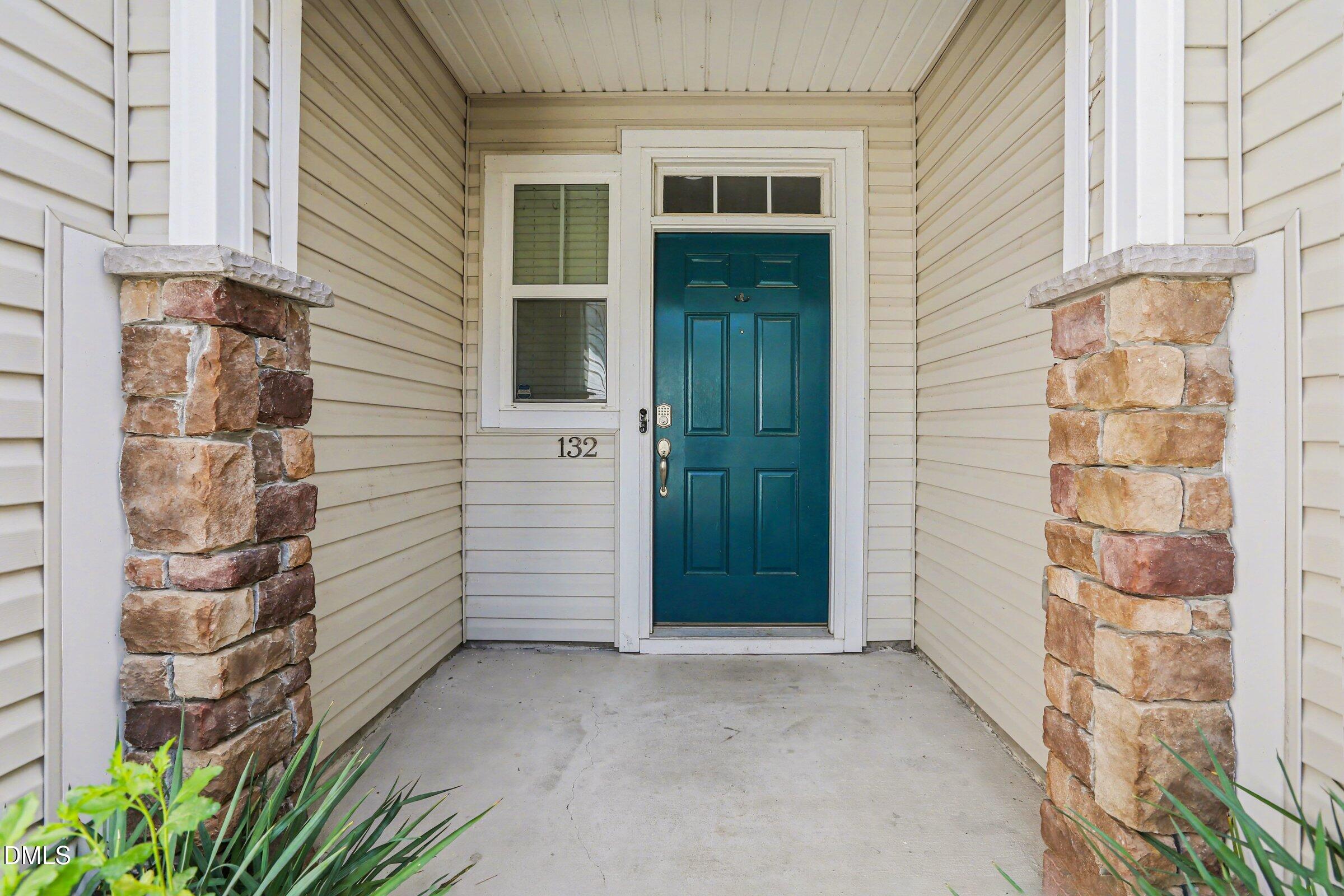 132 Daneborg Road Durham, NC 27703 - Photo 20 of 37 a view of a brick house with a door