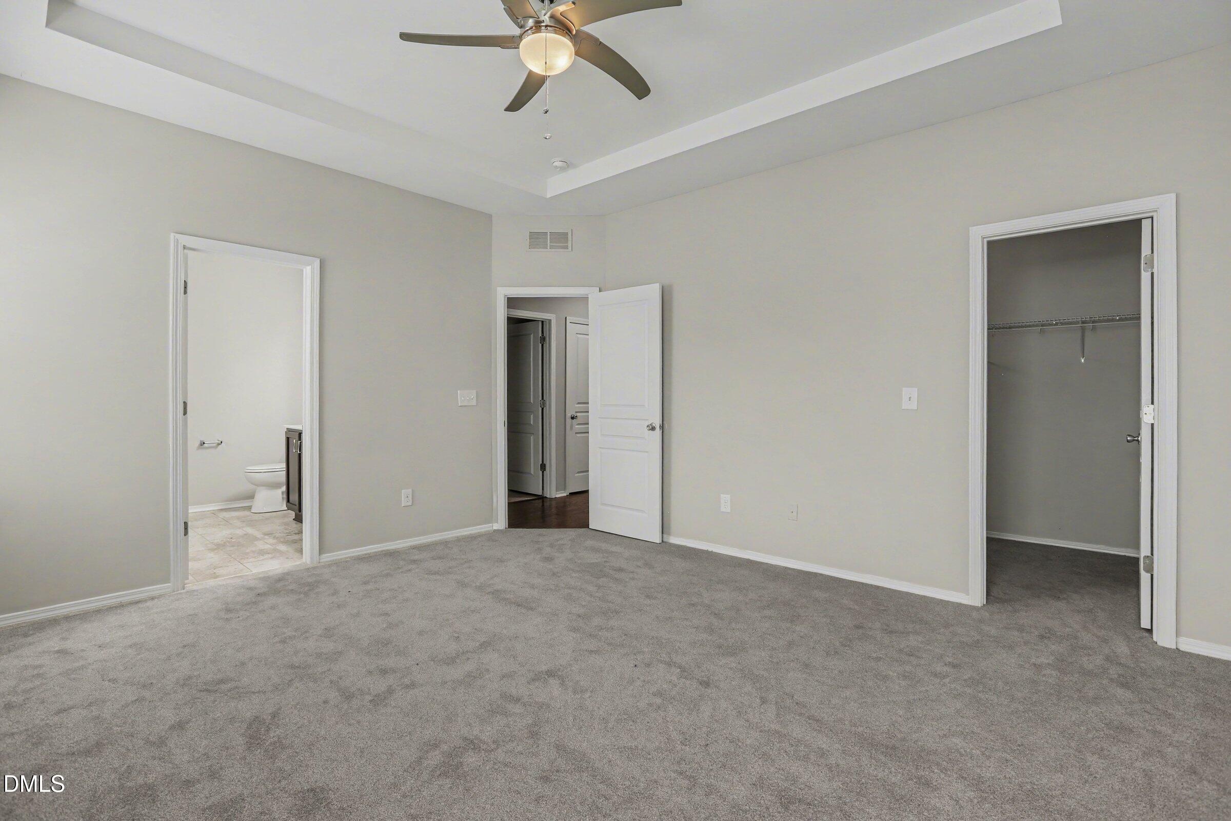 132 Daneborg Road Durham, NC 27703 - Photo 27 of 37 a view of an empty room with a chandelier fan