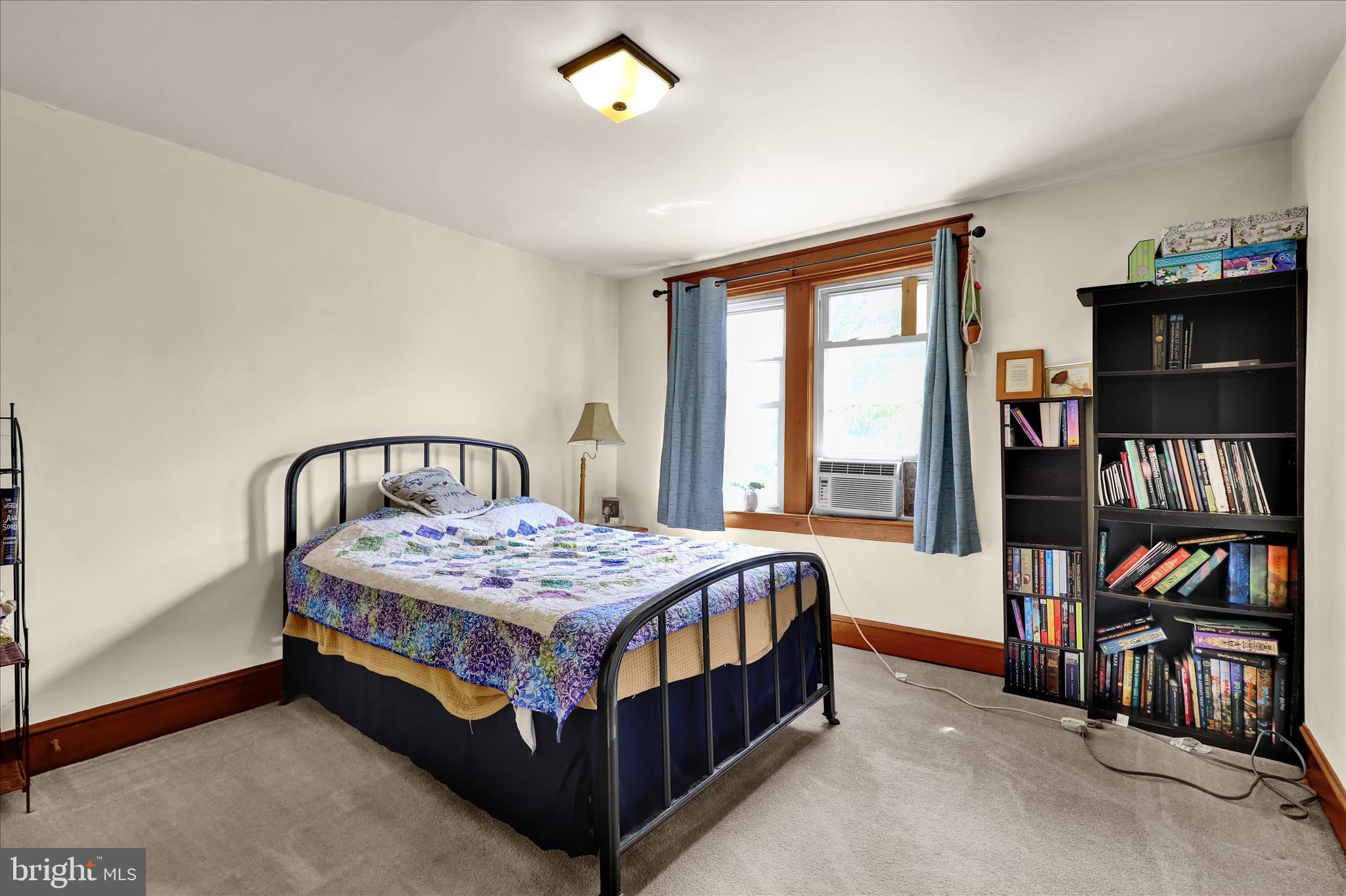43 East Walnut Street Ephrata, PA 17522 - Photo 20 of 32 a bedroom with a bed and a book shelf