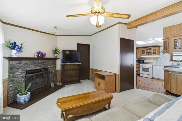 a room with water heater and wooden shelves