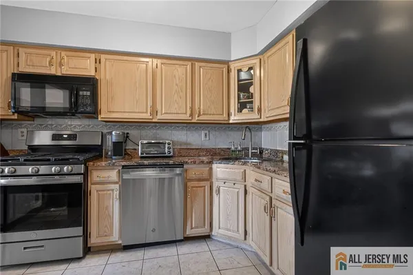 a kitchen with a stove and a microwave
