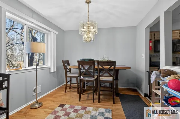a dining room with furniture and window