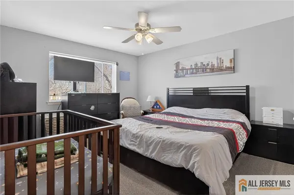 a bedroom with bed and a window
