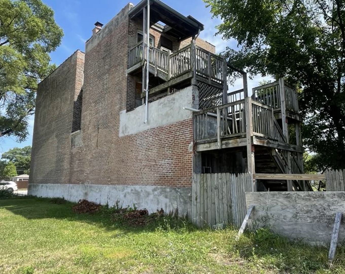 6938 South Halsted Street Chicago, IL 60621 - Photo 7 of 8 a view of a house with a yard