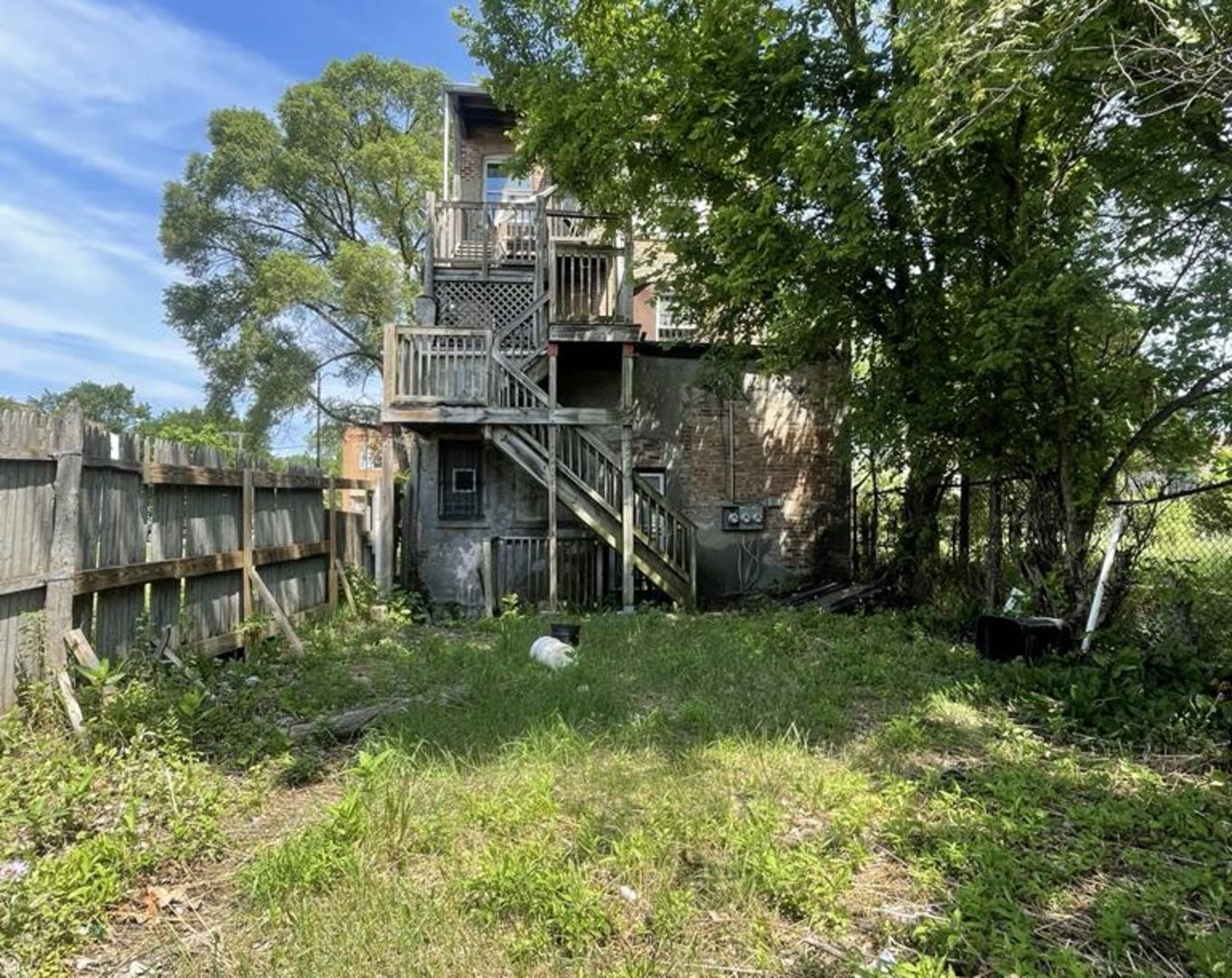 6938 South Halsted Street Chicago, IL 60621 - Photo 8 of 8 a view of a house with a back yard