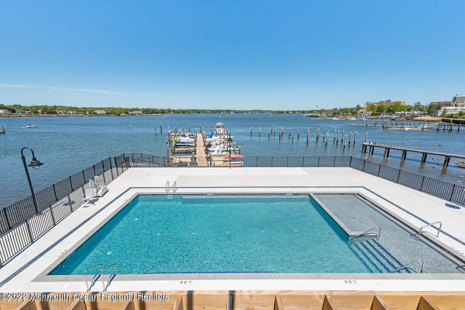 28 Riverside Avenue, Unit 6C Red Bank, NJ 07701 - Photo 1 of 26 a view of swimming pool with a ocean view
