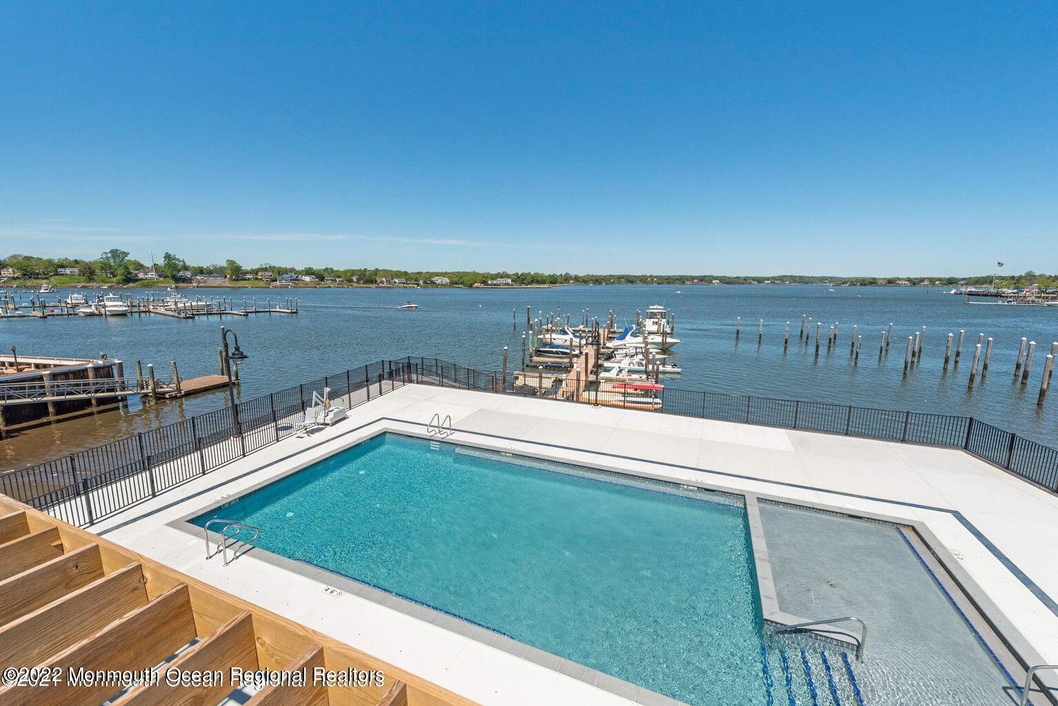 28 Riverside Avenue, Unit 6C Red Bank, NJ 07701 - Photo 25 of 26 a view of a lake with couches chairs