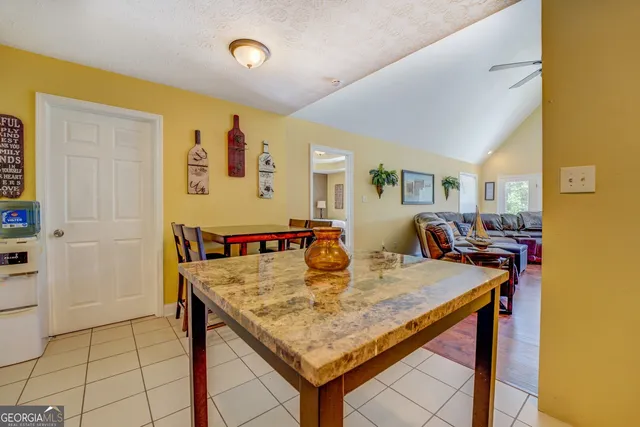 a living room with dining table