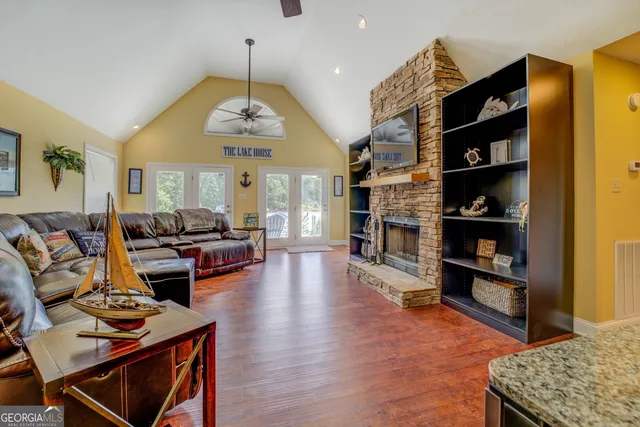 a living room with furniture and a book shelf