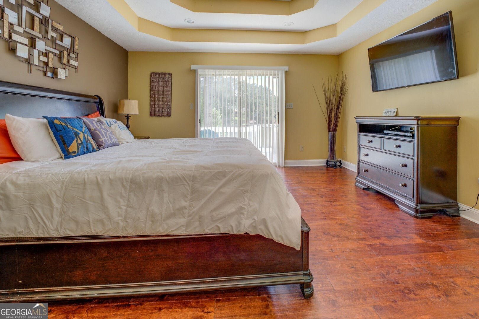 129 Old Kersey Road Jackson, GA 30233 - Photo 19 of 47 a bedroom with a bed and wooden floor