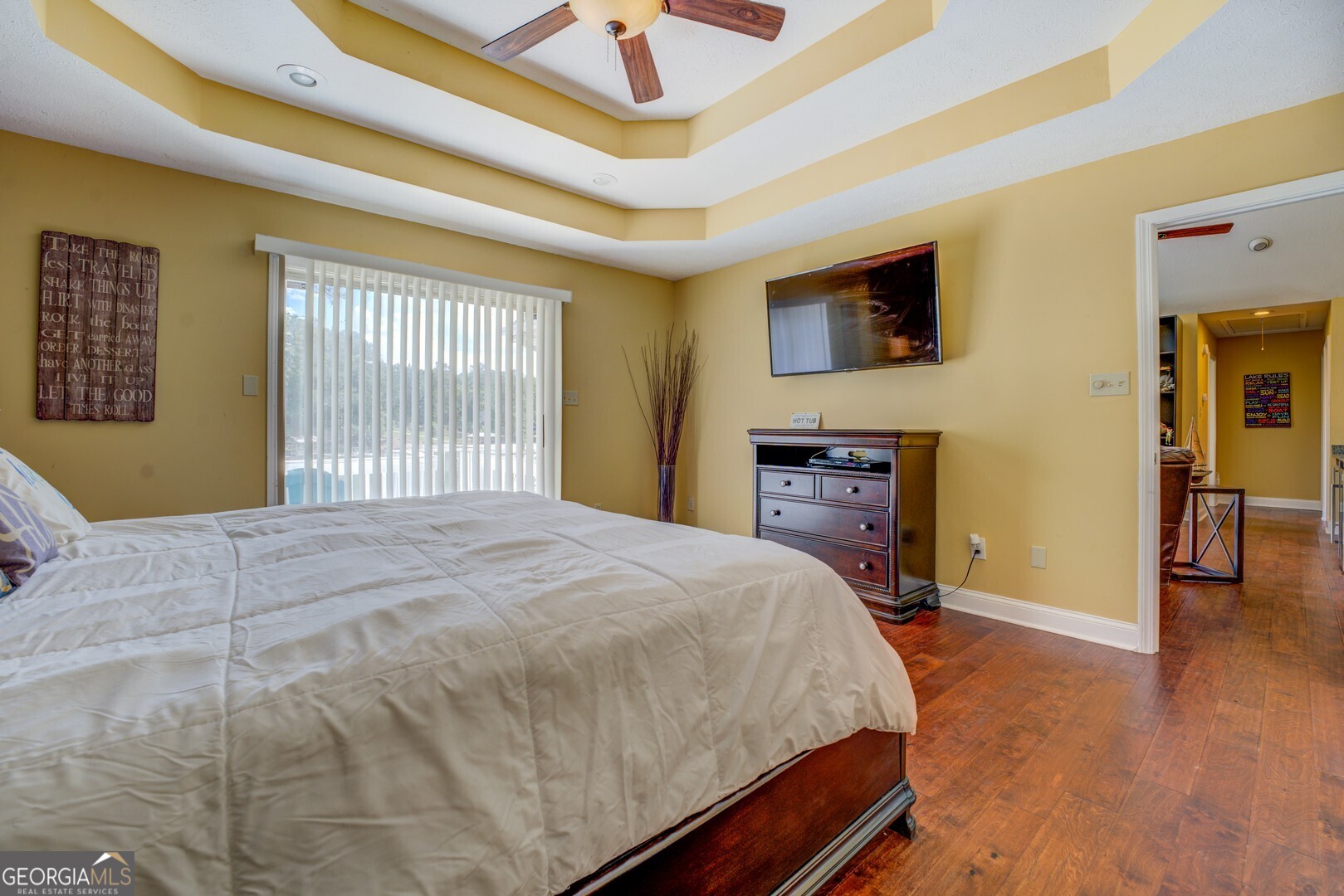 129 Old Kersey Road Jackson, GA 30233 - Photo 20 of 47 a bedroom with a bed and wooden floor