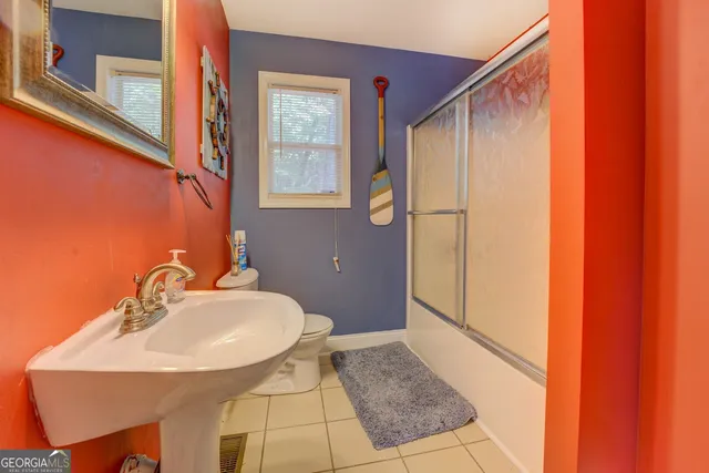 a bathroom with a sink and mirror