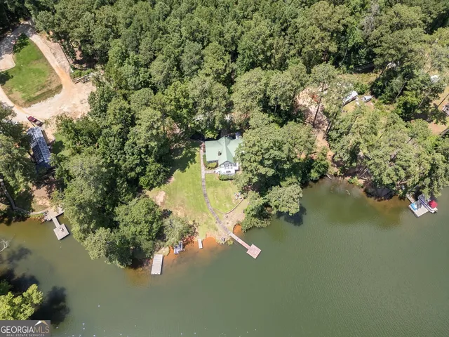 view of lake with green space