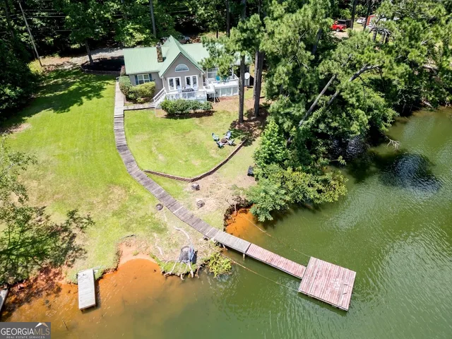 a view of a lake with a house in the background