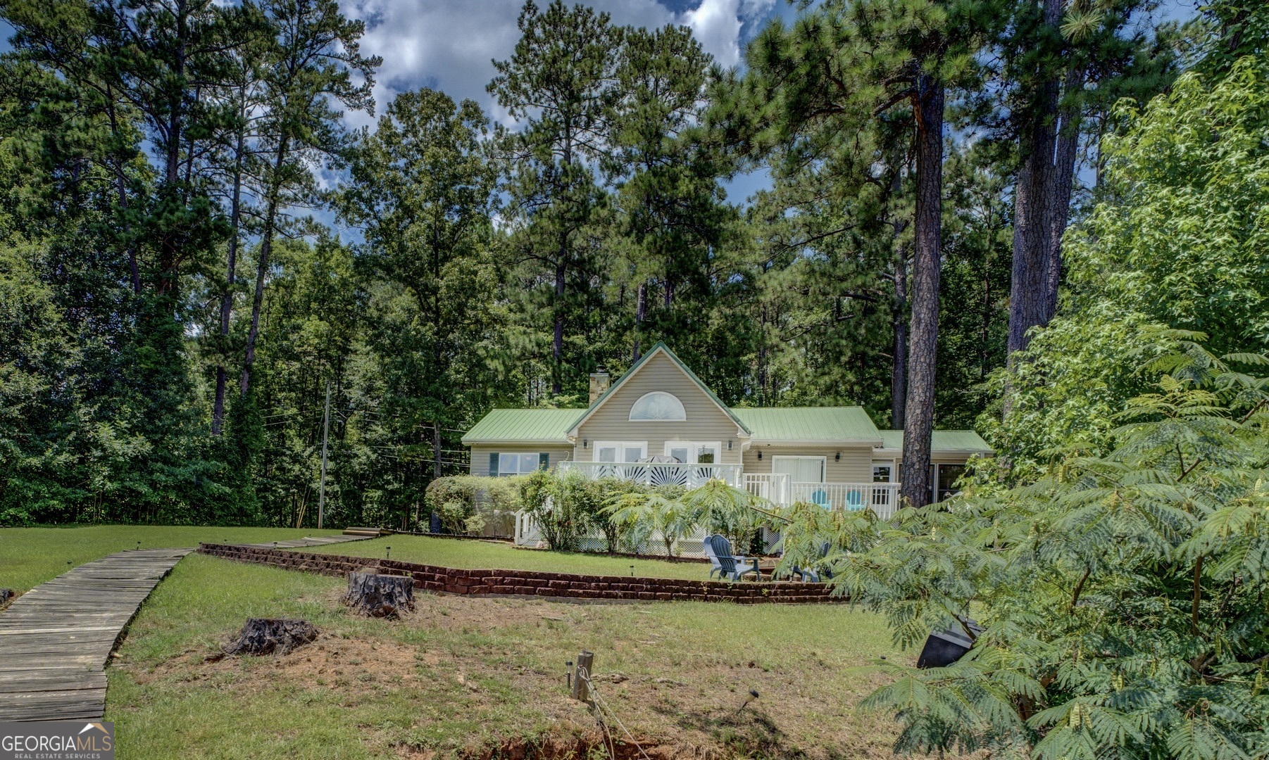 129 Old Kersey Road Jackson, GA 30233 - Photo 35 of 47 a front view of a house with a yard and trees