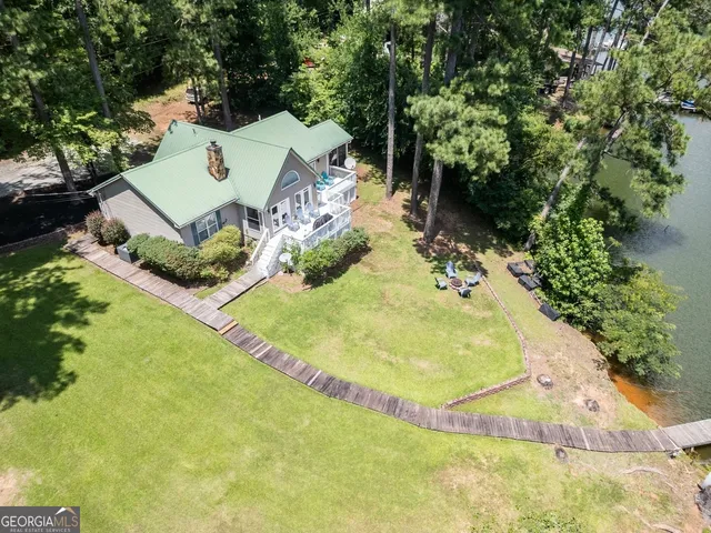 a view of a swimming pool with a yard