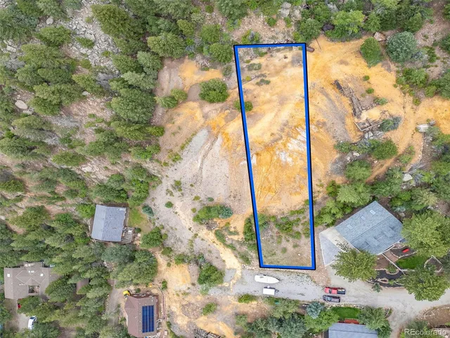 a view of a yard with a large tree