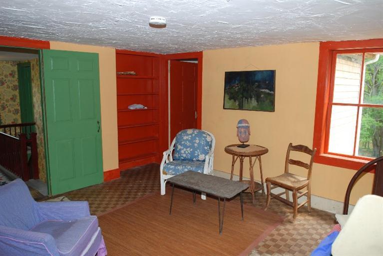1276 County Road Cataumet, MA 02534 - Photo 11 of 15 a living room with furniture a flat screen tv and kitchen view