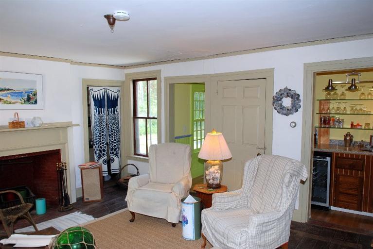 1276 County Road Cataumet, MA 02534 - Photo 6 of 15 a living room with furniture fireplace and a window