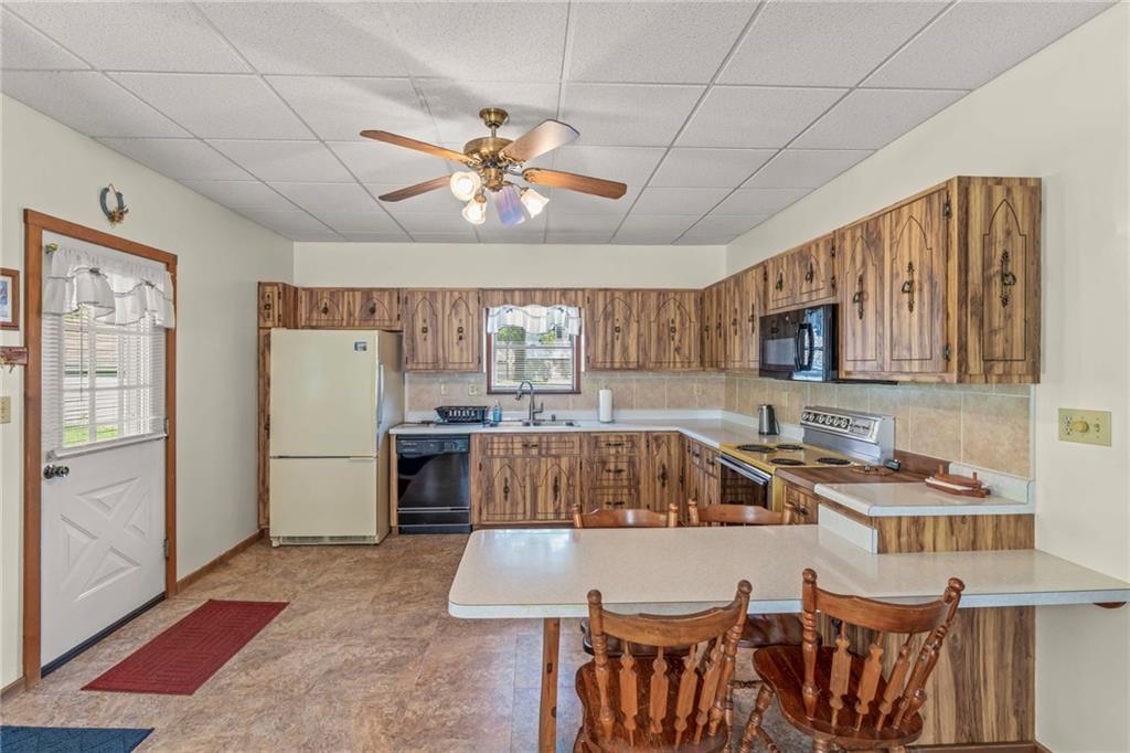 106 Donora Road Monongahela, PA 15063 - Photo 11 of 33 This 17X14 Kitchen Offers Tons Of Space And Plenty Of Cabinetry For All Your Storage Needs. A Convienent Table Is Built Into The Kitchen Area, Perfect For Casual Dining Or Entertaining Guests!
