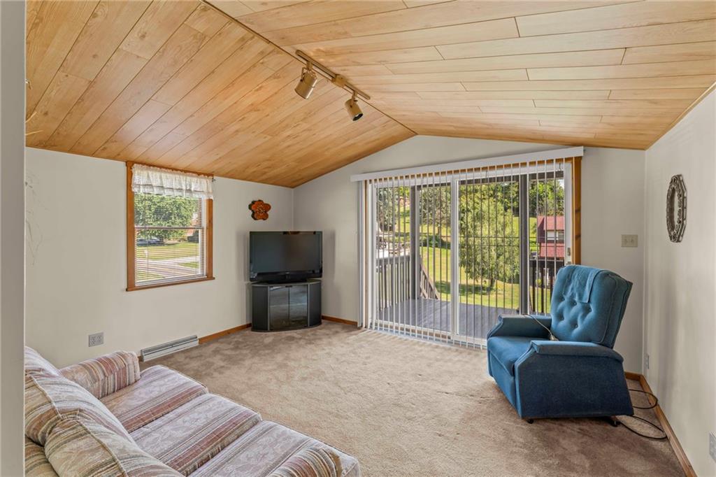 106 Donora Road Monongahela, PA 15063 - Photo 5 of 33 The Large Window And Sliding Glass Door Bathes The Room In Sunlight, Creating A Warm And Inviting Atmosphere