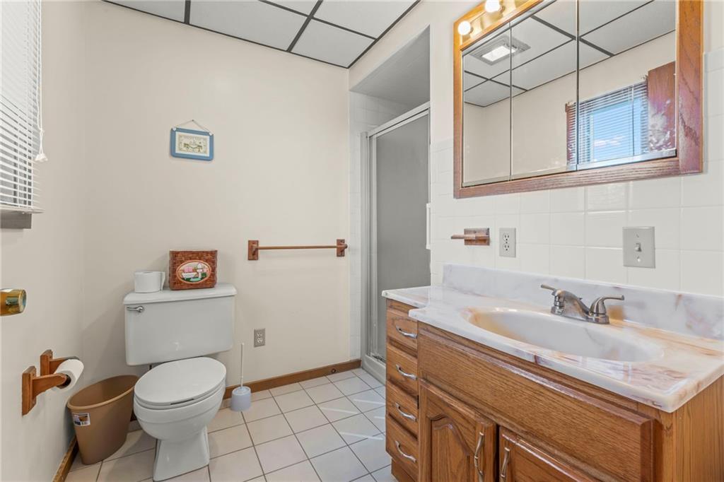 106 Donora Road Monongahela, PA 15063 - Photo 8 of 33 Master Bathroom Is Fully Equipped With Generous Sized Vanity With Overhead Lighting/Mirror Combo And Walk-In Shower