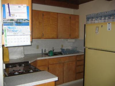 0 South Derrick Flat Road Trinity Center, CA 96091 - Photo 3 of 5 a kitchen with a sink a stove and a refrigerator