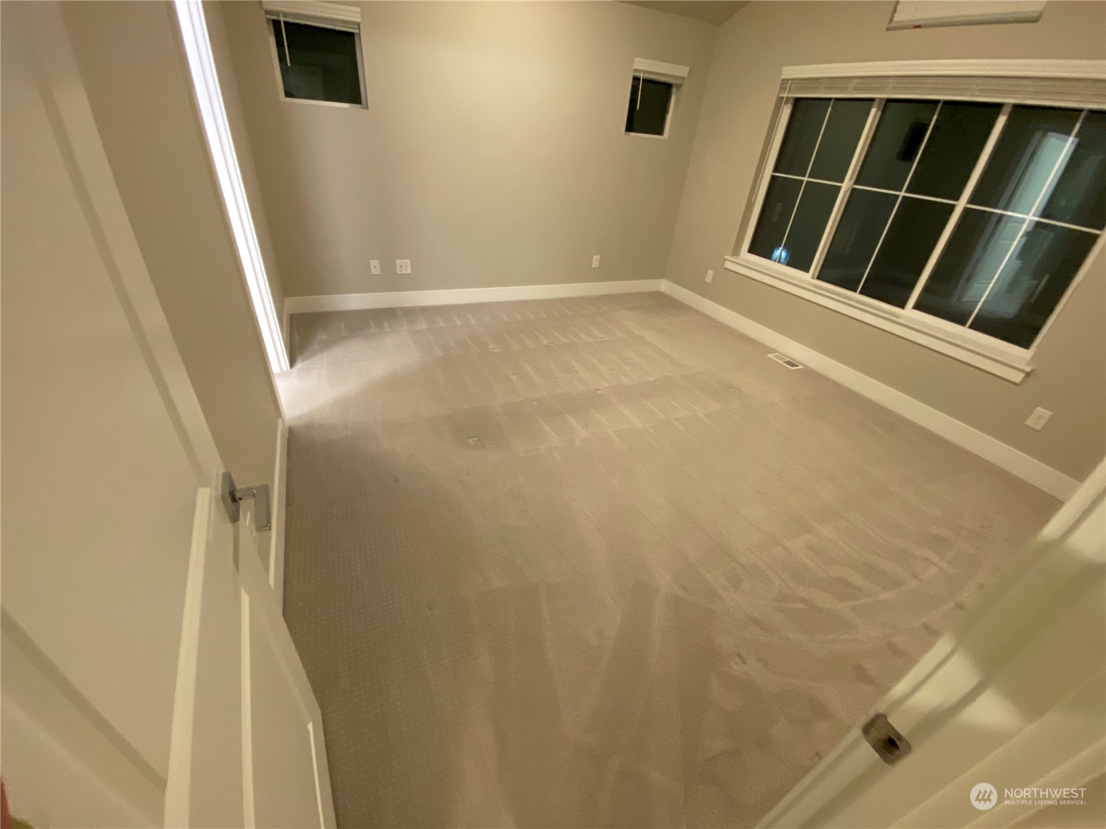 19721 Meridian Place West Bothell, WA 98012 - Photo 19 of 24 a view of an empty room with wooden floor