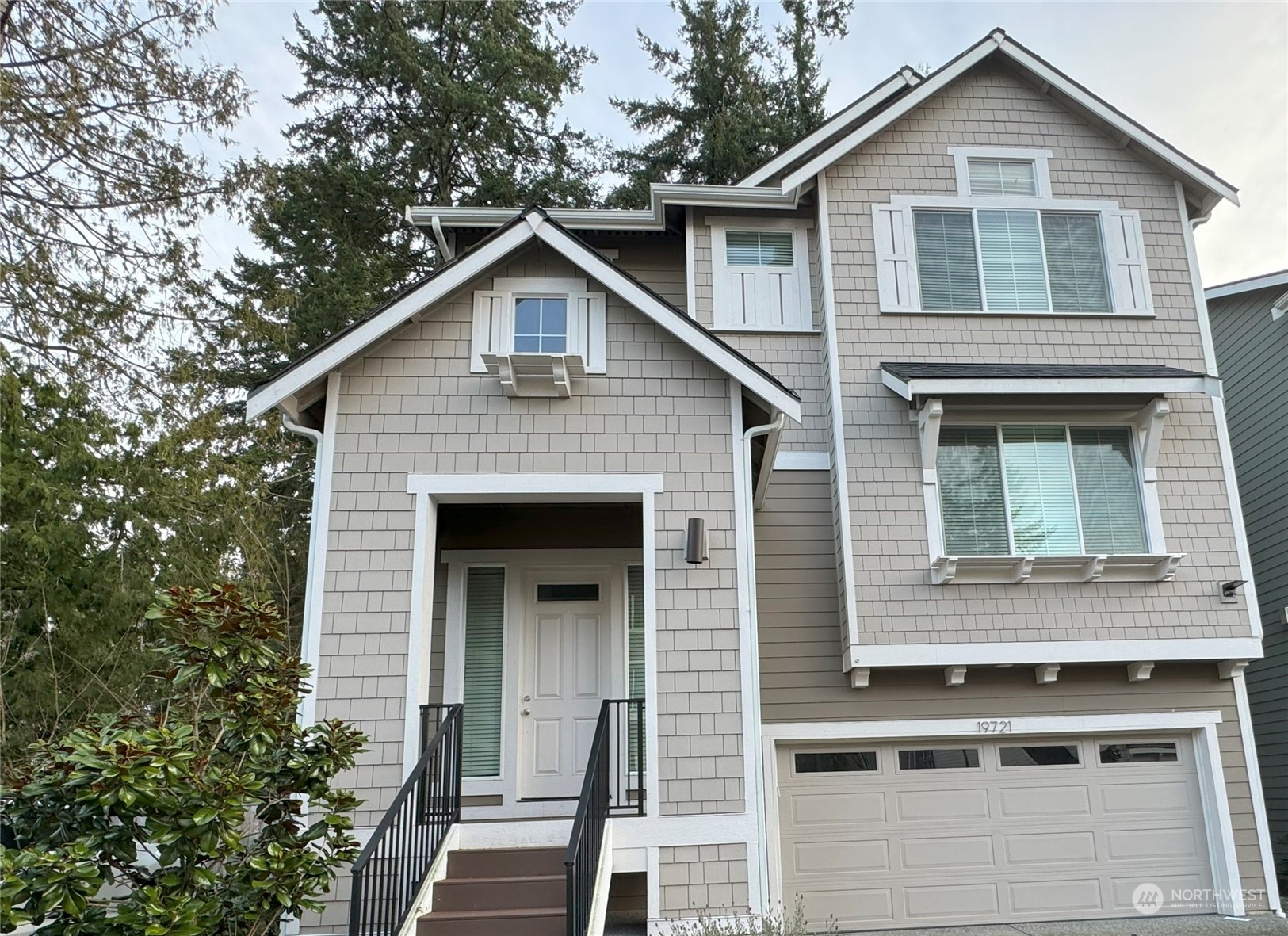 19721 Meridian Place West Bothell, WA 98012 - Photo 2 of 24 a front view of a house with a yard