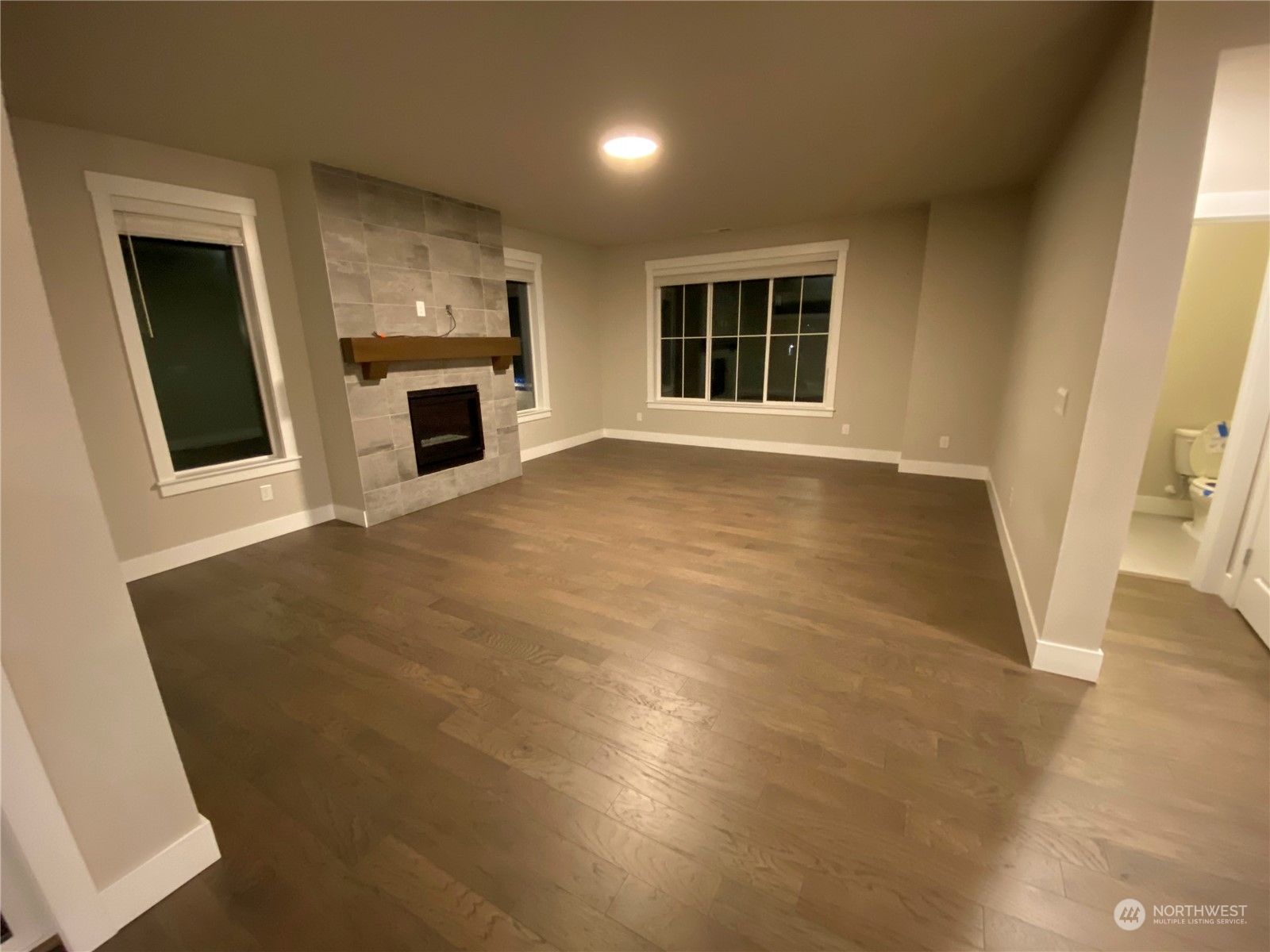 19721 Meridian Place West Bothell, WA 98012 - Photo 8 of 24 a view of an empty room with a window and fireplace