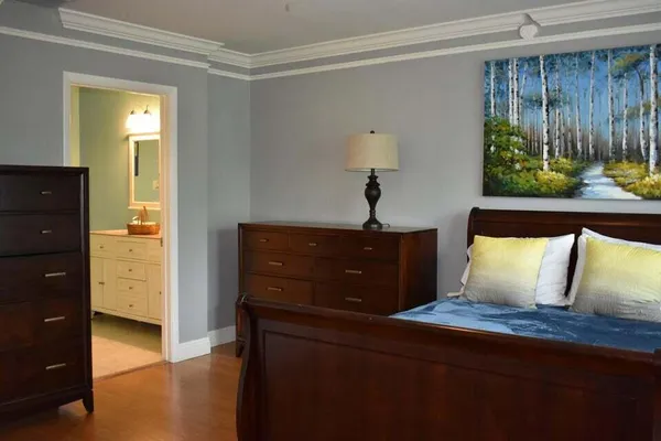 a view of room with window and hardwood floor